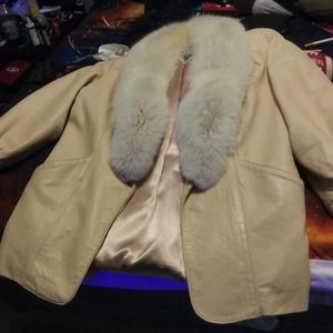 Its a j.percy for marvin richards leather fur coat